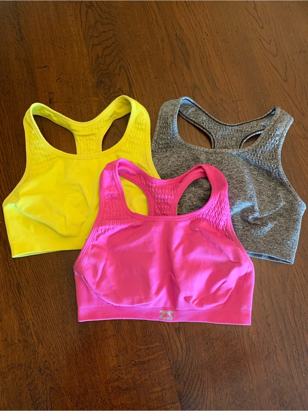 Zensah Racerback Sports Bras in Hot Pink, Bright Yellow, and Heather Gray